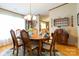 Well-lit dining area with wood floors, a classic chandelier, and ample seating, ideal for gatherings and entertaining at 404 St Lukes Church Rd, Kings Mountain, NC 28086