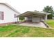 Spacious covered carport and garage offer ample parking and storage, with easy access to the main house at 404 St Lukes Church Rd, Kings Mountain, NC 28086
