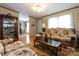 Cozy living room with wood-look floors, complemented by stylish furniture and plenty of natural light, creating a warm ambiance at 404 St Lukes Church Rd, Kings Mountain, NC 28086