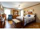 Serene bedroom with wood floors, a ceiling fan, and traditional furnishings, offering a peaceful retreat at 404 St Lukes Church Rd, Kings Mountain, NC 28086