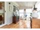 Bright sunroom with wood flooring, a table and chairs, and decorative elements at 404 St Lukes Church Rd, Kings Mountain, NC 28086