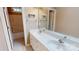 Bathroom with double sink vanity, white cabinets, and a shower-tub combination at 4066 Belle Meade Cir, Belmont, NC 28012