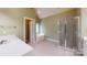 Bathroom featuring vanity, shower and soaking tub at 4066 Belle Meade Cir, Belmont, NC 28012