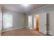 Bedroom featuring neutral walls, carpet, and trim, with a window for natural light at 4066 Belle Meade Cir, Belmont, NC 28012
