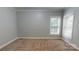 Bedroom featuring neutral walls, carpet, and trim, with two windows for natural light at 4066 Belle Meade Cir, Belmont, NC 28012