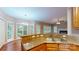 Bright kitchen with granite countertops, stainless sink, and natural light from a bay window at 4066 Belle Meade Cir, Belmont, NC 28012