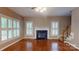 Bright living room with hardwood floors and a fireplace at 4066 Belle Meade Cir, Belmont, NC 28012