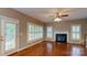 Living room featuring a fireplace, ceiling fan and hardwood floors at 4066 Belle Meade Cir, Belmont, NC 28012