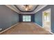 Spacious bedroom with tray ceiling, carpeted floor, and ensuite bathroom at 4066 Belle Meade Cir, Belmont, NC 28012
