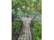 A cozy outdoor patio with comfortable chairs, a table, and a fire pit at 4066 Belle Meade Cir, Belmont, NC 28012