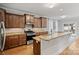 Well-equipped kitchen featuring granite countertops, stainless steel appliances, custom cabinets and an eat-in island at 409 W Kingston Ave, Charlotte, NC 28203