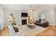 Inviting living room with a fireplace, modern furnishings, neutral color palette, and abundant natural light at 409 W Kingston Ave, Charlotte, NC 28203