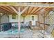 Charming back porch with grill, wood ceiling, seating, and lattice at 4122 Canal Rd, Marshville, NC 28103
