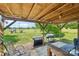 Charming back porch with a grill overlooking a large backyard and play equipment at 4122 Canal Rd, Marshville, NC 28103