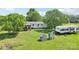 Lush yard featuring playset, RV, and covered porch, perfect for outdoor entertaining and enjoying quiet evenings at 4122 Canal Rd, Marshville, NC 28103