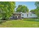 Large backyard with a back porch and lawn at 4122 Canal Rd, Marshville, NC 28103