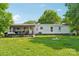Large backyard with a back porch and lawn at 4122 Canal Rd, Marshville, NC 28103