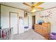 Bright, well-lit Bedroom featuring a crib, ceiling fan, and a dresser at 4122 Canal Rd, Marshville, NC 28103