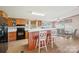 Spacious kitchen with a breakfast bar, wood cabinets, and an adjacent dining space for Gathering meals at 4122 Canal Rd, Marshville, NC 28103