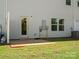 Backyard featuring a door to the house, a window, and an area of grass at 415 Tayberry Ln, Fort Mill, SC 29715