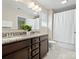 Bathroom featuring double vanity with granite countertops, a large mirror, and a shower with a curtain at 415 Tayberry Ln, Fort Mill, SC 29715