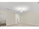Spacious bedroom with neutral carpet, attached bathroom, and overhead lighting at 415 Tayberry Ln, Fort Mill, SC 29715