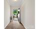 Bright foyer with hardwood floors leading to an open entryway, creating a welcoming ambiance at 415 Tayberry Ln, Fort Mill, SC 29715