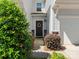 Inviting front entrance with a decorated door, lush landscaping, and stylish exterior accents at 415 Tayberry Ln, Fort Mill, SC 29715