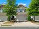 Charming townhome with a well-maintained front yard, two-car garage, and inviting curb appeal at 415 Tayberry Ln, Fort Mill, SC 29715