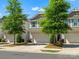 Well-manicured townhome exterior showcasing a two-car garage, neat landscaping, and inviting curb appeal at 415 Tayberry Ln, Fort Mill, SC 29715