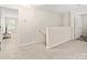 Upstairs hallway leading to various rooms with neutral carpet and paint at 415 Tayberry Ln, Fort Mill, SC 29715