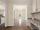 Hallway view with chandelier lighting and a glimpse into the living area at 415 Tayberry Ln, Fort Mill, SC 29715