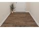 Hallway featuring dark wood-look flooring, white baseboards and trim, and a white door at 415 Tayberry Ln, Fort Mill, SC 29715