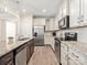 Modern kitchen featuring granite countertops, stainless steel appliances, and ample cabinet space at 415 Tayberry Ln, Fort Mill, SC 29715
