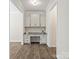 Home office includes custom cabinetry, granite countertops, and ample natural light at 415 Tayberry Ln, Fort Mill, SC 29715