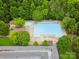 Aerial view of a large community pool surrounded by lush greenery and lounge chairs at 415 Tayberry Ln, Fort Mill, SC 29715
