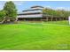 Lush green lawn, playground, and volleyball net offer ample outdoor recreational opportunities for residents at 415 Tayberry Ln, Fort Mill, SC 29715