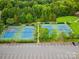 Aerial view of community tennis courts with green and blue surface, showcasing well-maintained facilities at 415 Tayberry Ln, Fort Mill, SC 29715