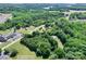 A picturesque aerial view of the property with lush green trees near Lake Norman at 4155 Slanting Bridge Rd, Sherrills Ford, NC 28673