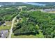 This aerial view shows the property's wooded boundaries, providing privacy and a sense of seclusion at 4155 Slanting Bridge Rd, Sherrills Ford, NC 28673