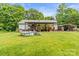 Expansive backyard featuring a covered deck, above ground pool and space for outdoor activities at 4155 Slanting Bridge Rd, Sherrills Ford, NC 28673
