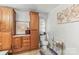 Bathroom with wood cabinets, toilet, and a world map wall art at 4155 Slanting Bridge Rd, Sherrills Ford, NC 28673
