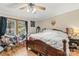 Bedroom with hardwood flooring, a ceiling fan and a large window with lots of natural light at 4155 Slanting Bridge Rd, Sherrills Ford, NC 28673