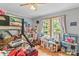Bright bedroom with a bunk bed, desk, and natural light streaming through the double windows at 4155 Slanting Bridge Rd, Sherrills Ford, NC 28673