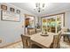 The dining room features natural light and a view into the kitchen with a sliding glass door leading to the patio at 4155 Slanting Bridge Rd, Sherrills Ford, NC 28673