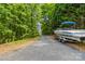 View of a boat parked in the driveway, suggesting convenient access for lake activities and outdoor adventures at 4155 Slanting Bridge Rd, Sherrills Ford, NC 28673