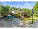 Exterior view showcasing a well-maintained home with space for parking, storage, and outdoor entertainment at 4155 Slanting Bridge Rd, Sherrills Ford, NC 28673