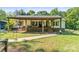 Charming home with a covered front porch, offering a welcoming entrance and outdoor living space at 4155 Slanting Bridge Rd, Sherrills Ford, NC 28673