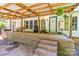 Charming front porch with brick base and steps, featuring a swing and space for seating at 4155 Slanting Bridge Rd, Sherrills Ford, NC 28673