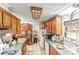 Well-equipped kitchen featuring plenty of storage, including glass-front cabinets, tile floor and countertops at 4155 Slanting Bridge Rd, Sherrills Ford, NC 28673